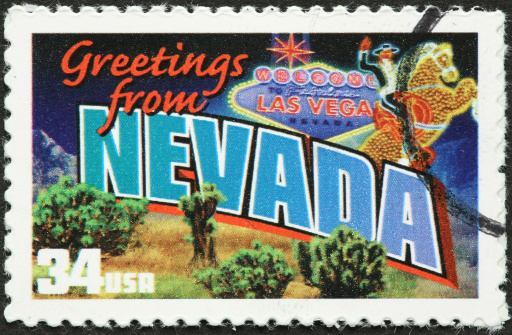 postage stamp with vintage Nevada welcome sign.