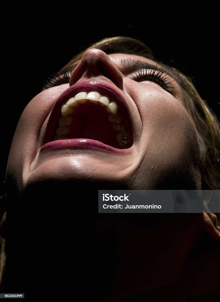 Despaired woman "Screaming young woman on black background  (this picture has been taken with a Hasselblad H3D II 31 megapixels camera) For more pictures of this model, please click on the following image" Crying Stock Photo