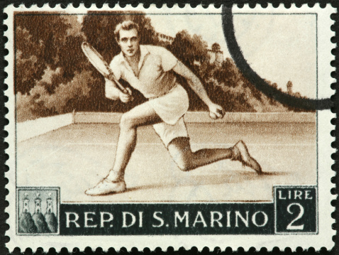 old fashioned tennis player on a San Marino stamp