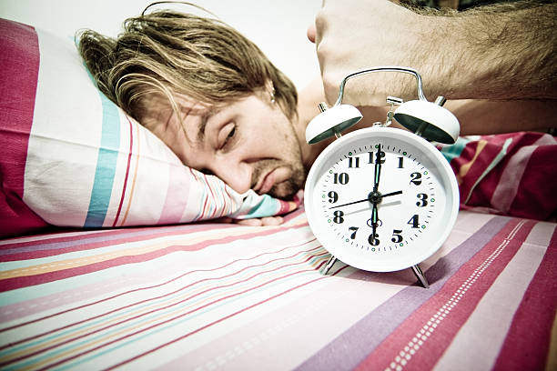 Shut up! "Man smashing alarm clock, toning, shot was made with 12-24 lenses" smash alarm clock stock pictures, royalty-free photos & images