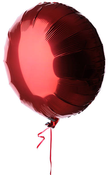 Red Foil Balloon with Matching Ribbon A round red foil balloon with a matching red ribbon.Isolated against a white background. helium stock pictures, royalty-free photos & images