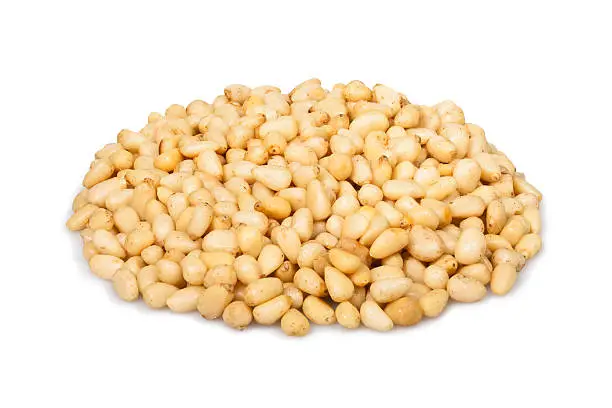 pine nuts heap on white background