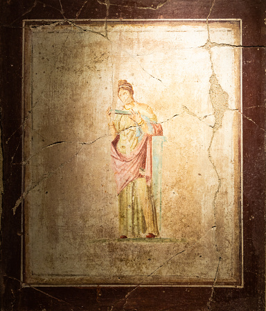 Fragment of wall painting of an Orthodox church, old cracked paint on a concrete wall, texture background.
