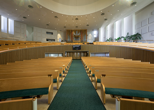 Columbus, Indiana, USA - October 30, 2023: Interior nave and pipe organ in back of the contemporary St Peter's Lutheran Church in Columbus