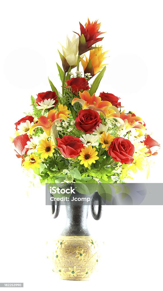 Multicolored flowers in a vase, isolated on white background Botany Stock Photo