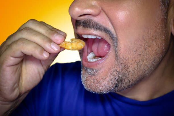 istock Close-up of the mouth eating a crayfish 1822542615