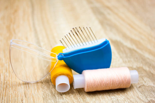 istock Metal needles next to threads. Sewing needles, object, accessory of a tailor. 1822542661