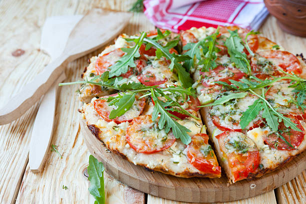 istock homemade pizza with tomatoes, cheese and arugula 182255241