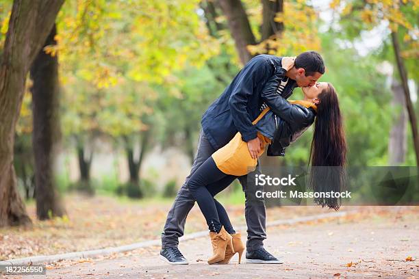 Couple Kissing Outdoor In The Park Stock Photo - Download Image Now - Adult, Autumn, Beautiful People