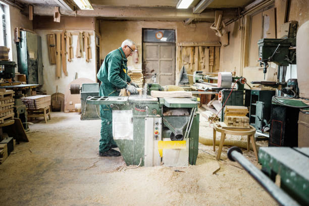 istock Technician makes furniture parts in carpentry workshop 1822577448
