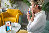 Woman watching an online medical tutorial at home