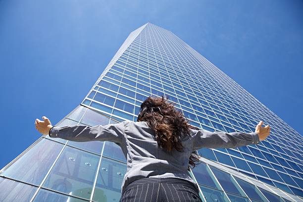 istock businesswoman adoring crystal skyscraper 182261074