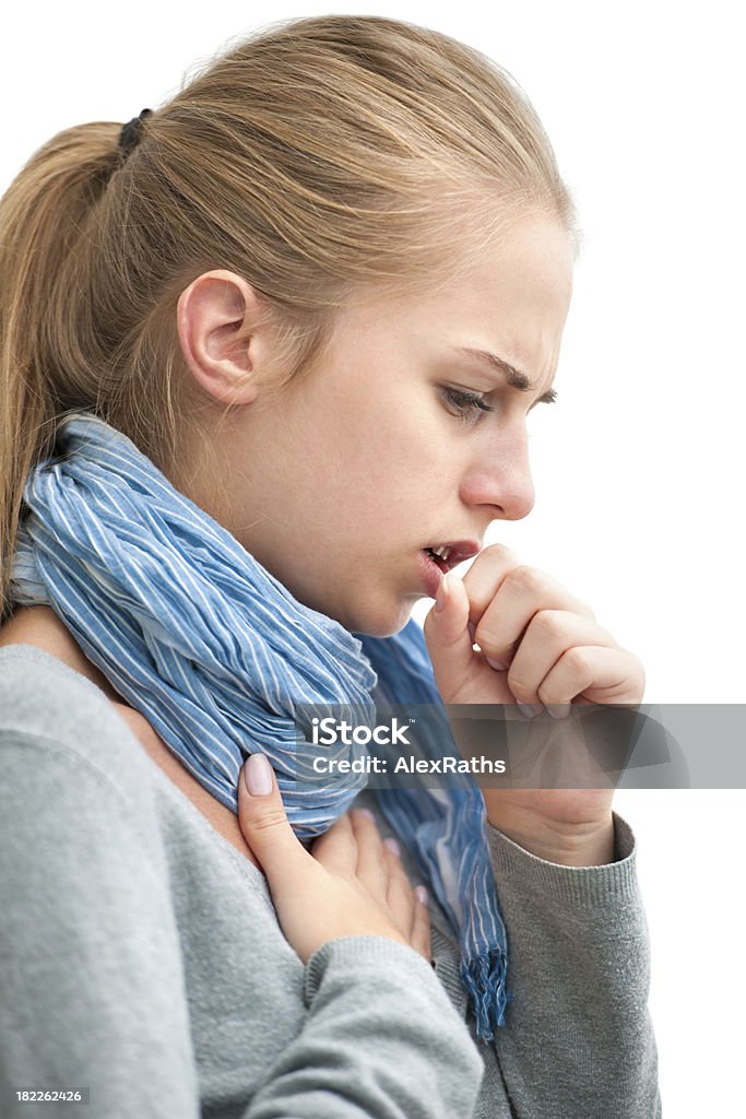 Young woman experiencing cough and congestion portrait of an young woman coughing with fist 20-29 Years Stock Photo