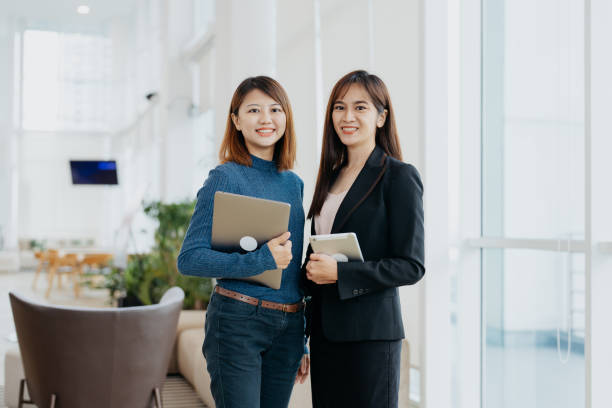 istock Two Asian businesswomen in modern office 1822630010