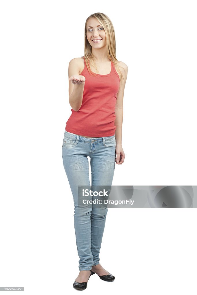 Young woman showing something on the palm of her hand Portrait of pretty young woman showing something on the palm of her hand, against white background Joy Stock Photo