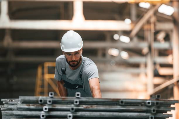 istock Young factory worker in grey uniform 1822656161