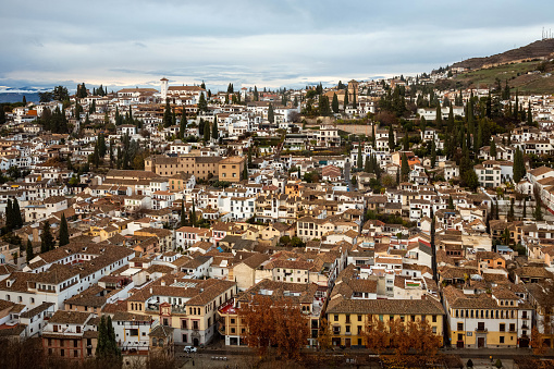 Ronda and Puente Viejo (Old Bridge) . Aerial view of houses and cathedral in Ronda, Andalusia, Spain