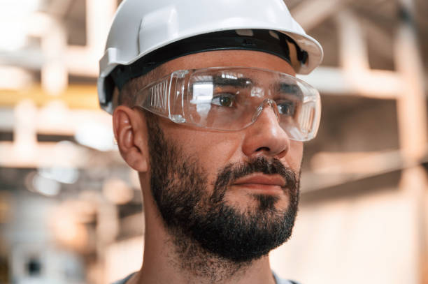 istock Beautiful portrait. Young factory worker in grey uniform 1822678210