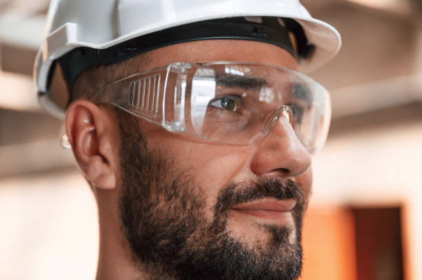 istock Beautiful portrait. Young factory worker in grey uniform 1822678231