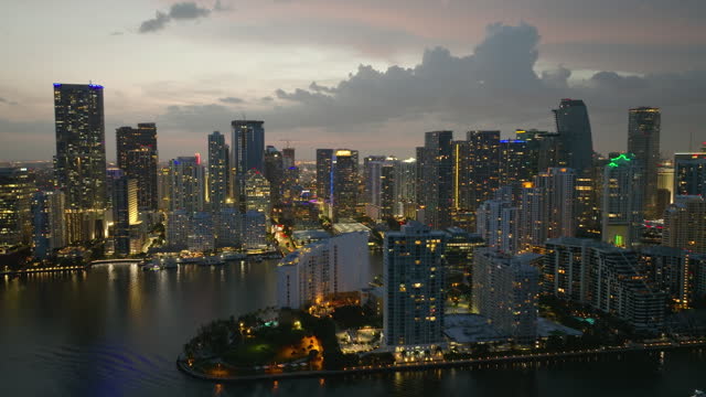 Downtown district of Miami Brickell in Florida, USA at night. Urban landscape of high waterfront skyscraper buildings in modern American megapolis