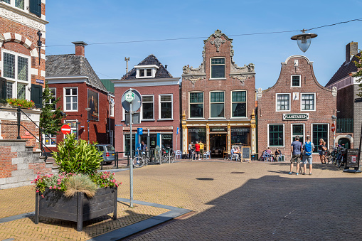 Franeker, Netherlands, August 22, 2019; Town Hall Square with monumental houses in the center of the Frisian town of Franeker.