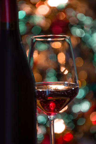 istock vinRed wine with Christmas tree bokeh 1822707261