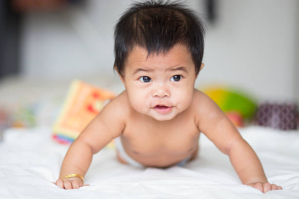 istock baby girl crawling 182271099