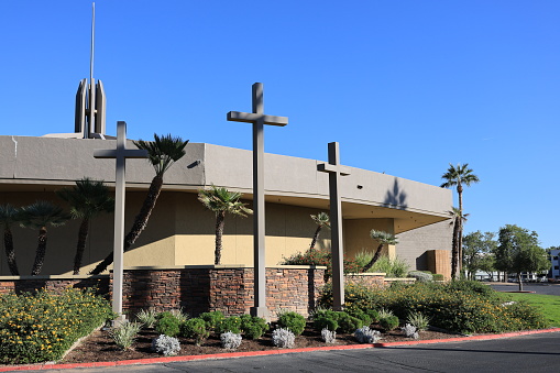 Phoenix, AZ - November 11, 2023:  Tall Crosses at front wall of Palmcroft Church located along major city avenue in North-West Phoenix, Arizona