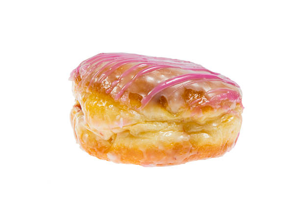 coberto de camada lustrosa bismarck isolado - bismarck donuts imagens e fotografias de stock