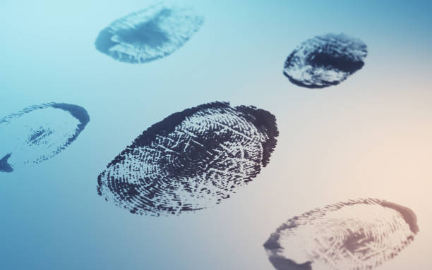 istock Black Fingerprint Review viewed on soft blue orange background 1822729423
