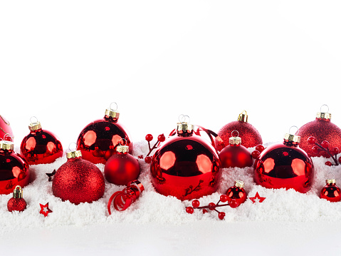 red christmas balls long frame on snow background
