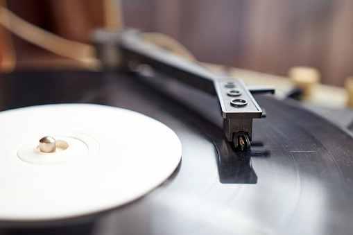 Vinyl record player. Needle player close up. Retro vinyl record player.