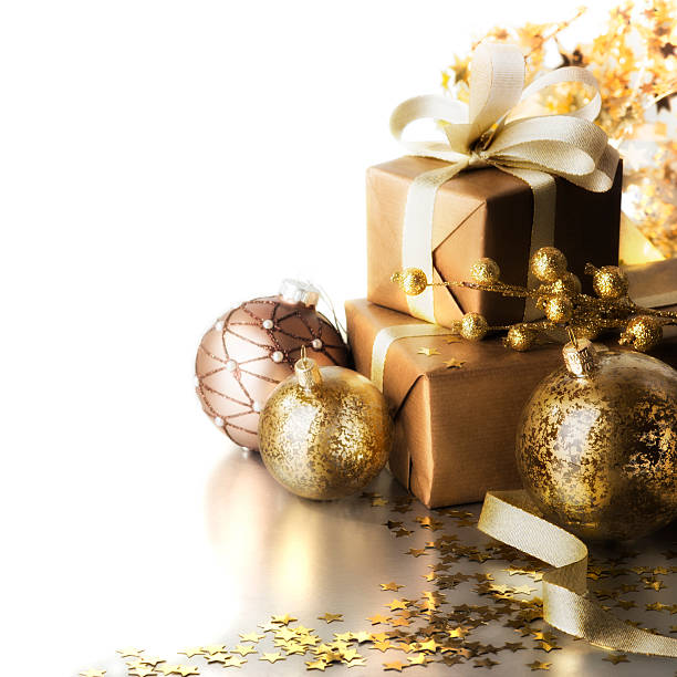 Golden Christmas gifts and ornaments aligned to the right stock photo
