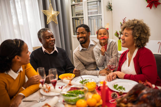 istock Family having fun on Christmas Eve by the table. 1822738704