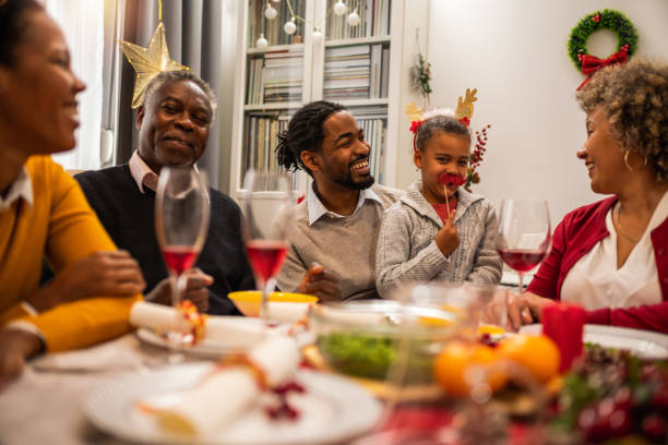 istock Family having fun on Christmas Eve by the table. 1822740389