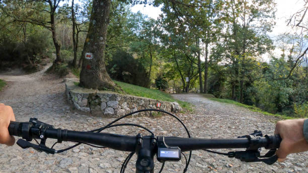 istock POV of mountain biker at fork in road 1822741470
