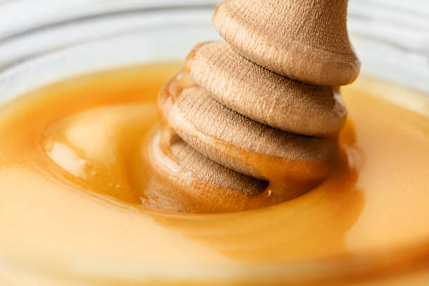 istock honey dipper in a jar of honey 1822744271