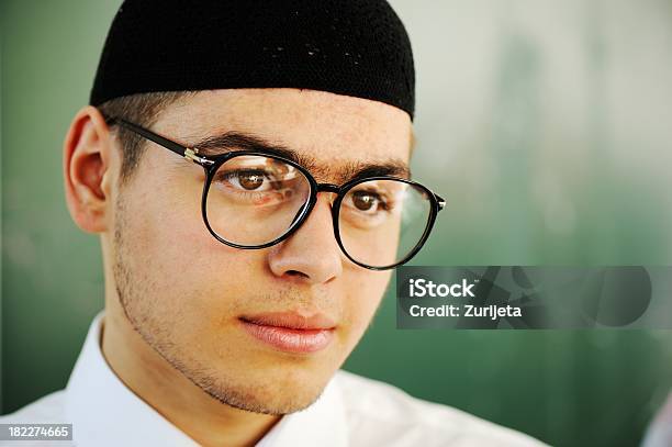 Portrait Of Male Student Looking Happy And Smiling Stock Photo - Download Image Now - Adolescence, Adult, Arabia