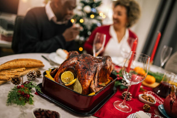istock Roasted turkey served on the dining table for family Christmas dinner. 1822747106