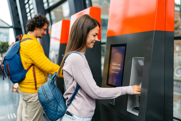 istock Young Woman Buying Train Ticket Using Her Smartphone At The Train Station In Malmo 1822747628
