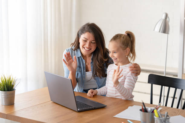 istock A cheerful mother and daughter engage in a video call over a laptop computer 1822747671