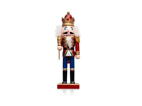 Christmas Nutcracker isolated on white background. Traditional wooden figurine.