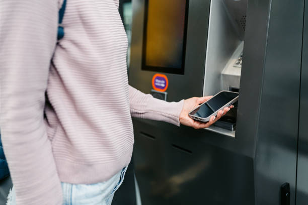 istock Young Woman Buying Train Ticket Using Her Smartphone At The Train Station In Malmo 1822749379