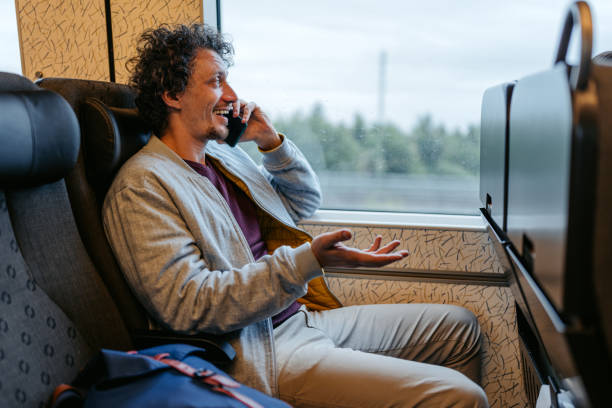 istock Adult Man Talking On The Phone While Riding The Train In Malmo 1822749943