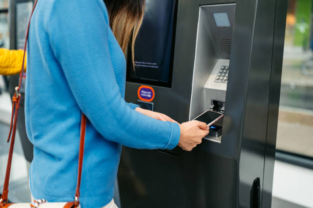 istock Young Woman Buying Train Ticket Using Her Smartphone At The Train Station In Malmo 1822751108