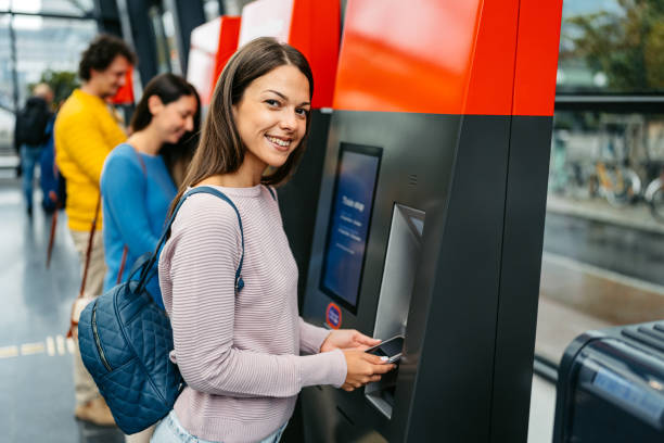 istock Young Woman Buying Train Ticket Using Her Smartphone At The Train Station In Malmo 1822755639