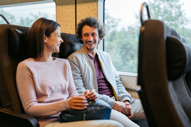 istock Young Couple Travelling Together By Train And Talking In Malmo 1822755660