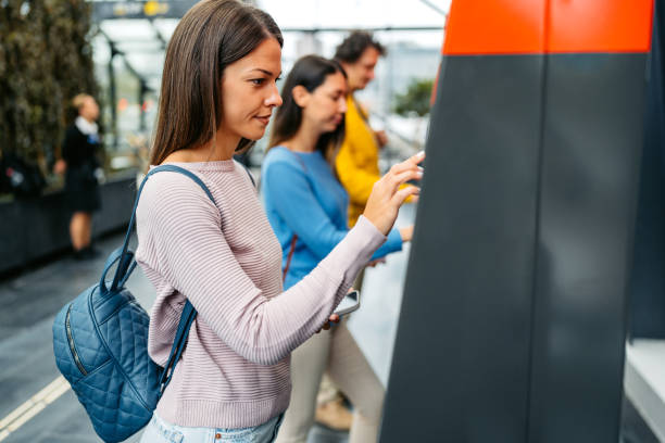 istock Young Woman Buying Train Ticket Using Her Smartphone At The Train Station In Malmo 1822756214