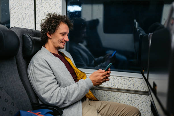 istock Adult Man Using His Phone On The Train Ride In Malmo At Night 1822756756