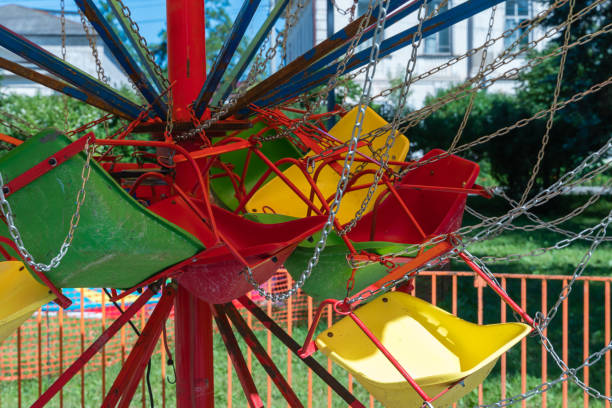 istock Myshkin, Russia, July 9, 2023. Bright plastic seats of a children s carousel. 1822757496